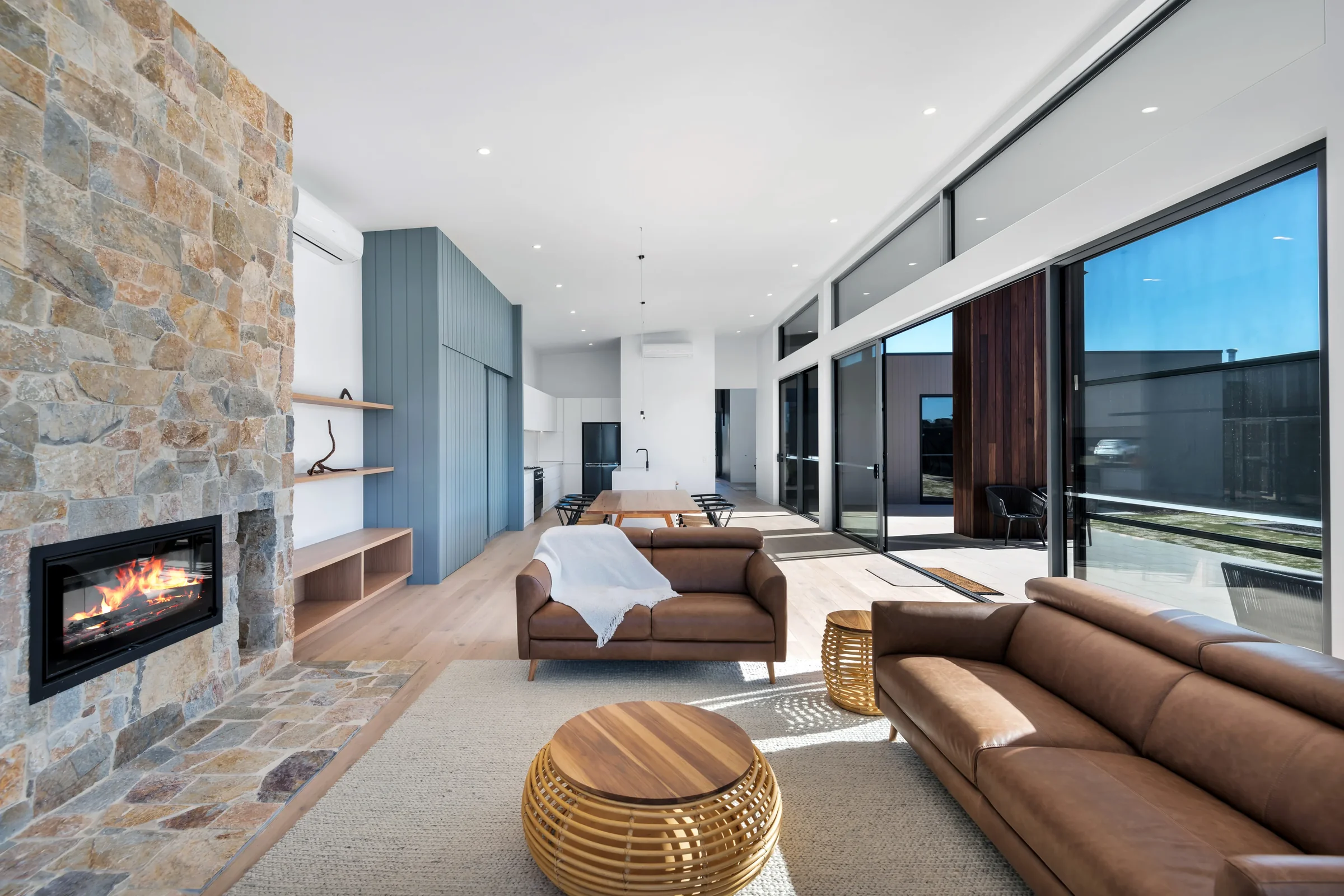 Coastal residence. Deep overhangs. Pool to the north.